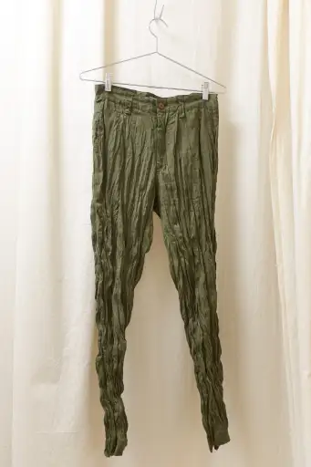 Issey Miyake green wrinkled trousers