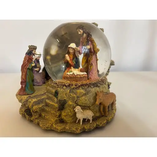 Sankyo Musical Nativity Snow Globe Christmas Decor Holy Family Three Wise Men

Sankyo musical snow globe featuring a detailed nativity scene with the Holy Family inside the glass orb and the Three Wise Men, a shepherd, and animals positioned on the rocky resin base. This hand-painted religious decoration plays a classic holiday tune when wound from the bottom. The globe is filled with distilled water and fine glitter, creating a serene atmosphere when shaken. A beautiful centerpiece for Christmas decor or a thoughtful gift for collectors of religious figurines.

Measurements:
• Height: 5.5"
• Base Width: 5"

#Vintage #Handmade