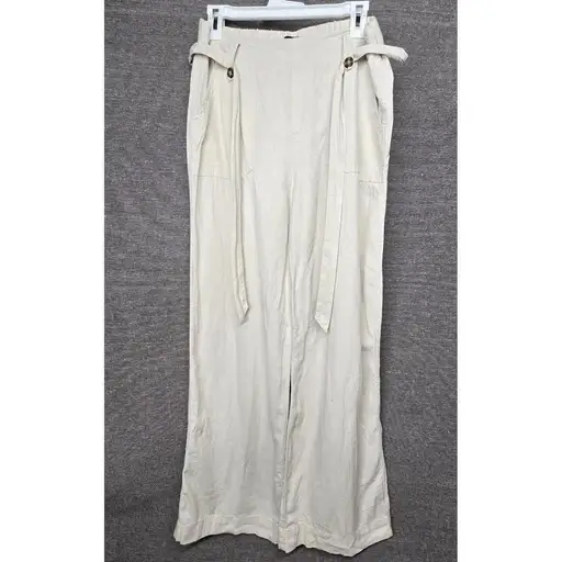Beau Dawson Linen Blend Wide Leg Pants Beige High Waist Resortwear Beach Size M

Beau Dawson wide leg pants offer a relaxed yet sophisticated aesthetic, crafted from a breathable linen and rayon blend. These high-waisted trousers feature a comfortable elasticized back waistband and a stylish self-tie belt detail accented by buttons at the hips. Designed with a clean front and functional side pockets, they provide a breezy silhouette perfect for warm-weather styling or coastal-inspired looks.

Measurements:
• Waist: 15" (30" doubled)
• Rise: 12"
• Inseam: 31"
• Leg Opening: 11.5" (23" doubled)

#Neutral #Resortwear #Casual #Office