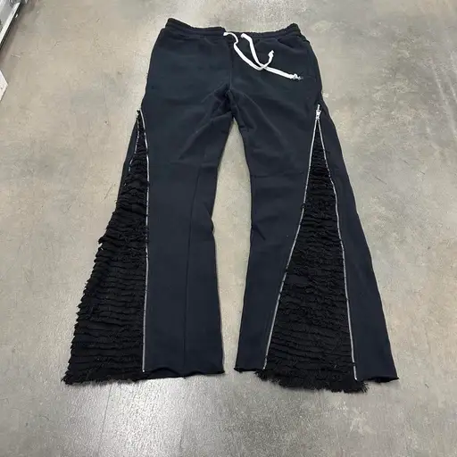 crazy y2k style archive style tornado mart inspired Black sweatpants with ruffled fringe detailing on the sides #heavyweight #archive #bootcut #baggy
size 2xl fits like a large mens 
tagged tornado mart for exposure 
the brand is called demik