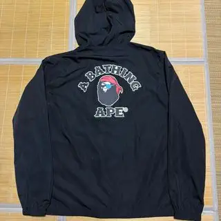 APE BAPE PIRATE STORE ナイロンジャケット　パーカー　XL アベイシングエイプ(A BATHING APE)のメンズのジャケット/アウター(ナイロンジャケット)の商品詳細ページへのリンク
