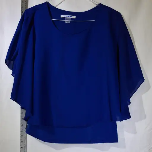 NYGARD Royal Blue Chiffon Blouse with Flowy Sleeves and Asymmetrical Hem. SEE PUCS. SMALL WASHABLE STAIN ON BACK.
#chiffon #asymmetrical