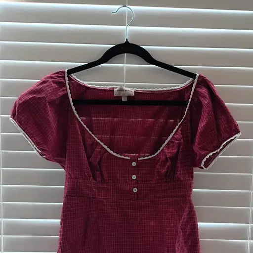 super cute red plaid top with white lace trim. size large but fits more like a small