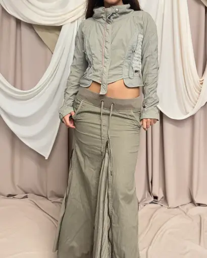 CROPPED STRUCTURED JACKET WITH MESH PANELS AND UTILITARIAN DETAILS by Marithé + François Girbaud